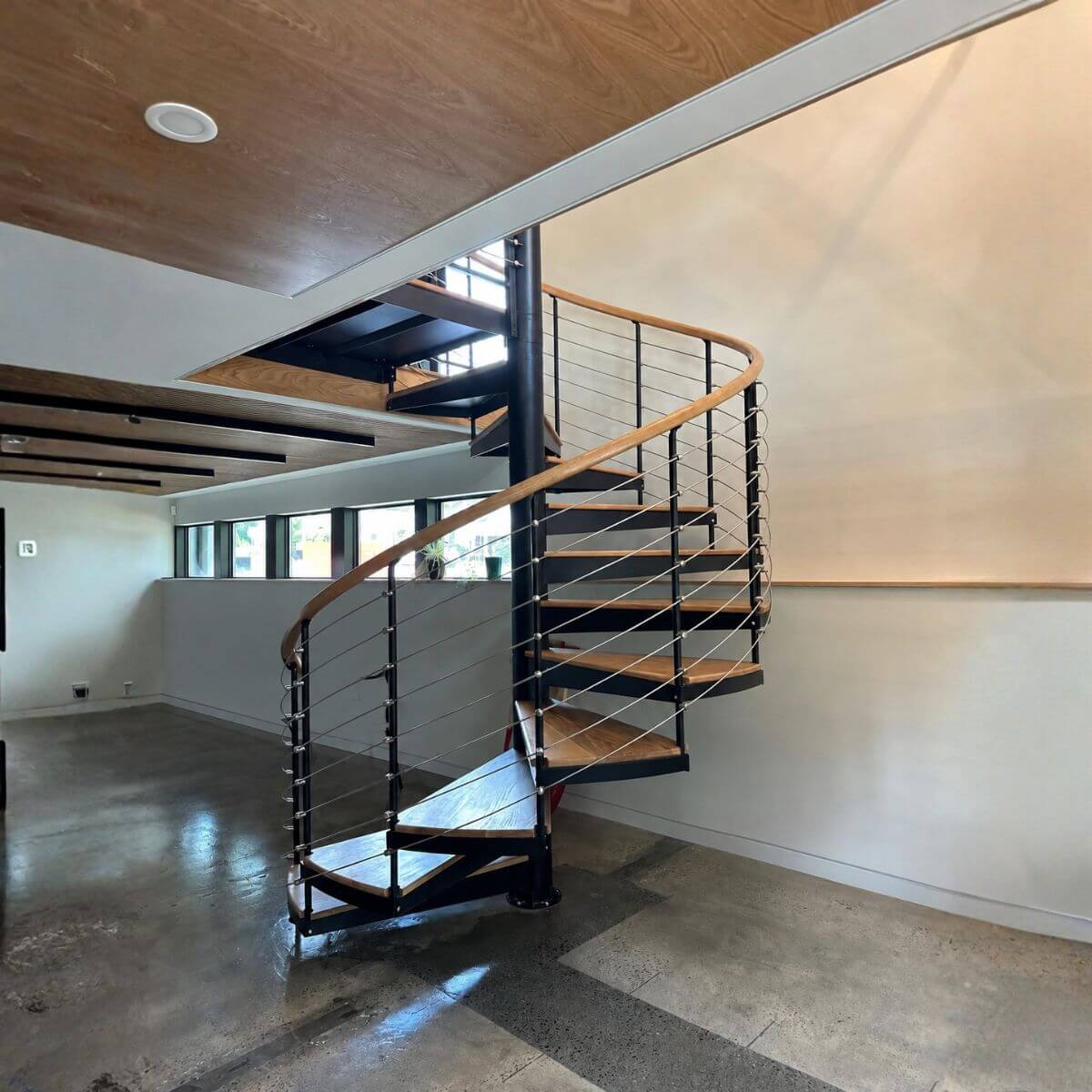 Spiral stairs with cable railing in Raleigh, NC